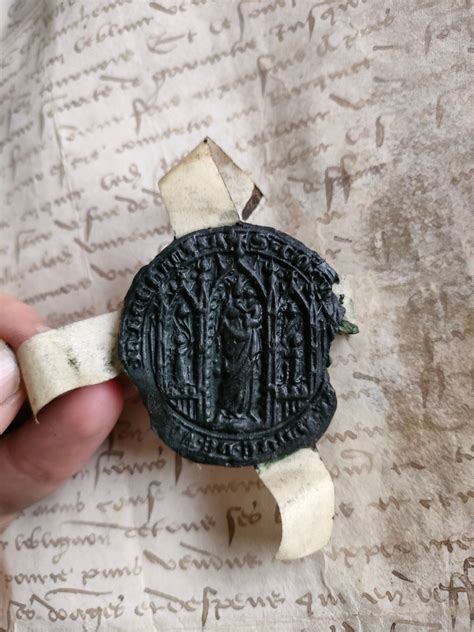 Illustration d'un sceau médiéval sur un document