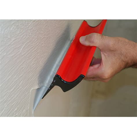 Outil pour lisser l'enduit de placo