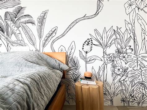 Chambre d'enfant décorée avec une fresque murale jungle