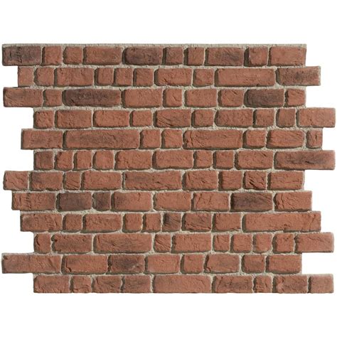 Panneaux imitation brique en polystyrène appliqués sur un mur intérieur